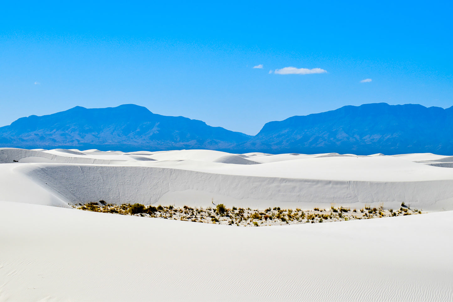 This is a photo looking at the mountains to the west of White Sands National Park in New Mexico. White Sands National Park is the largest gypsum dune in the world. It was taken mid-October 2021.